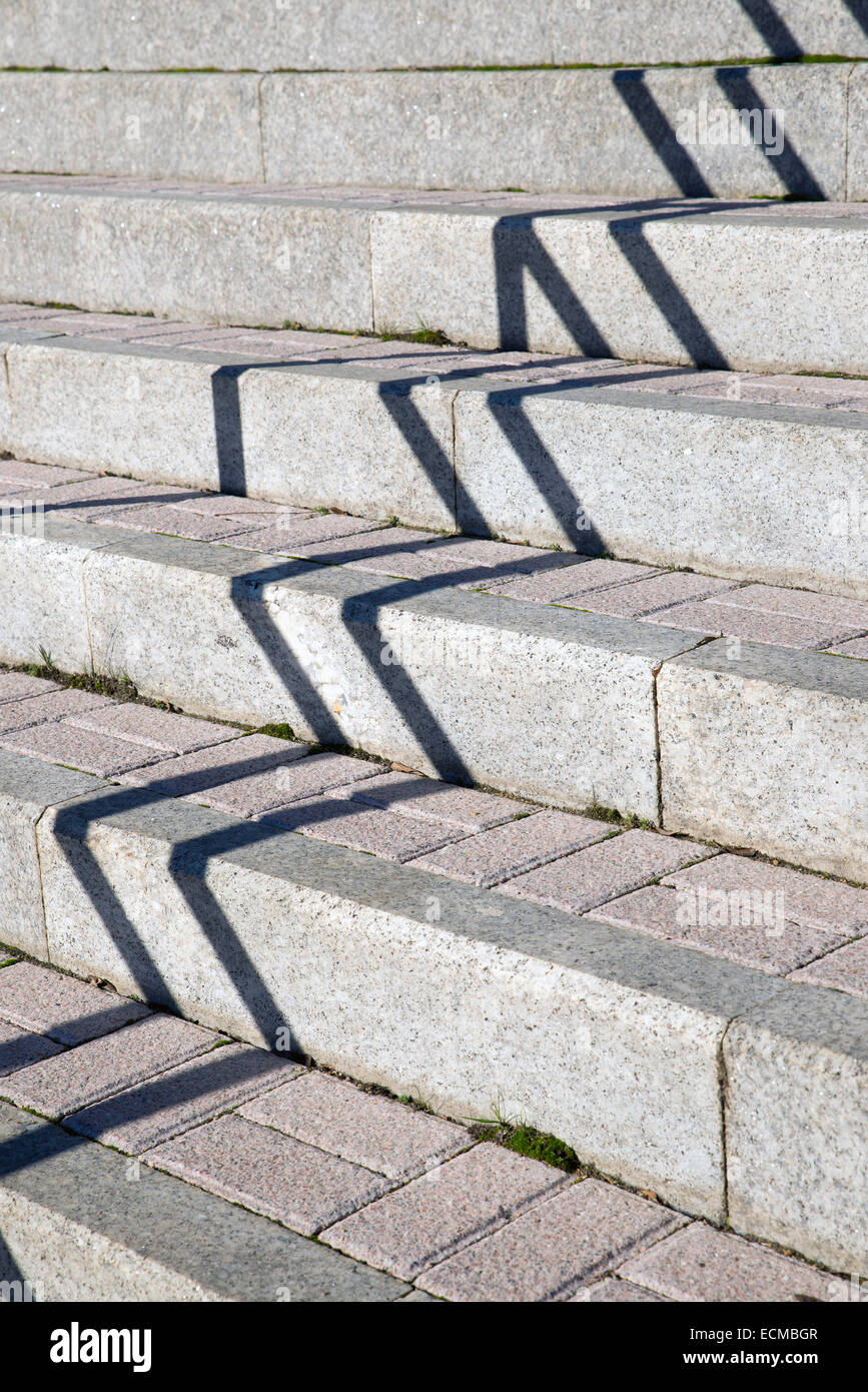 Shadow and light makes zigzag pattern on stone stairs Stock Photo