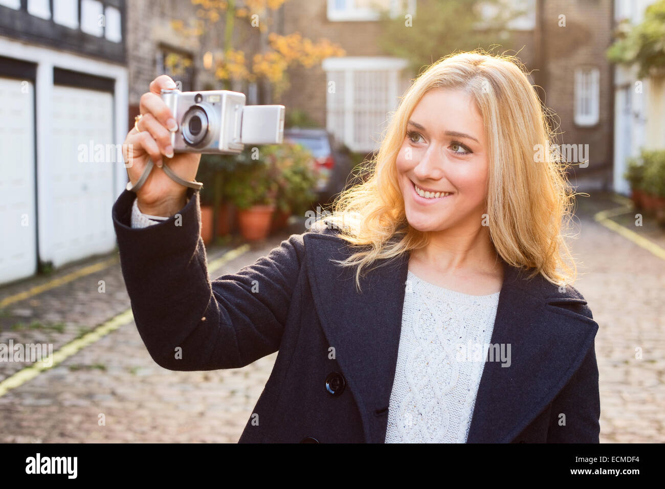 young woman taking a photo Stock Photo