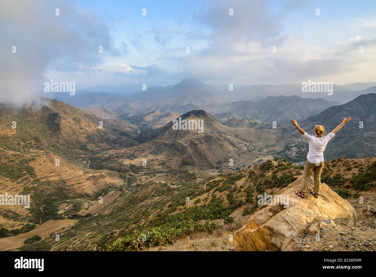 Woman enjoying the view over the mountains along the road from Massawa to Asmarra, Eritrea Stock Photo