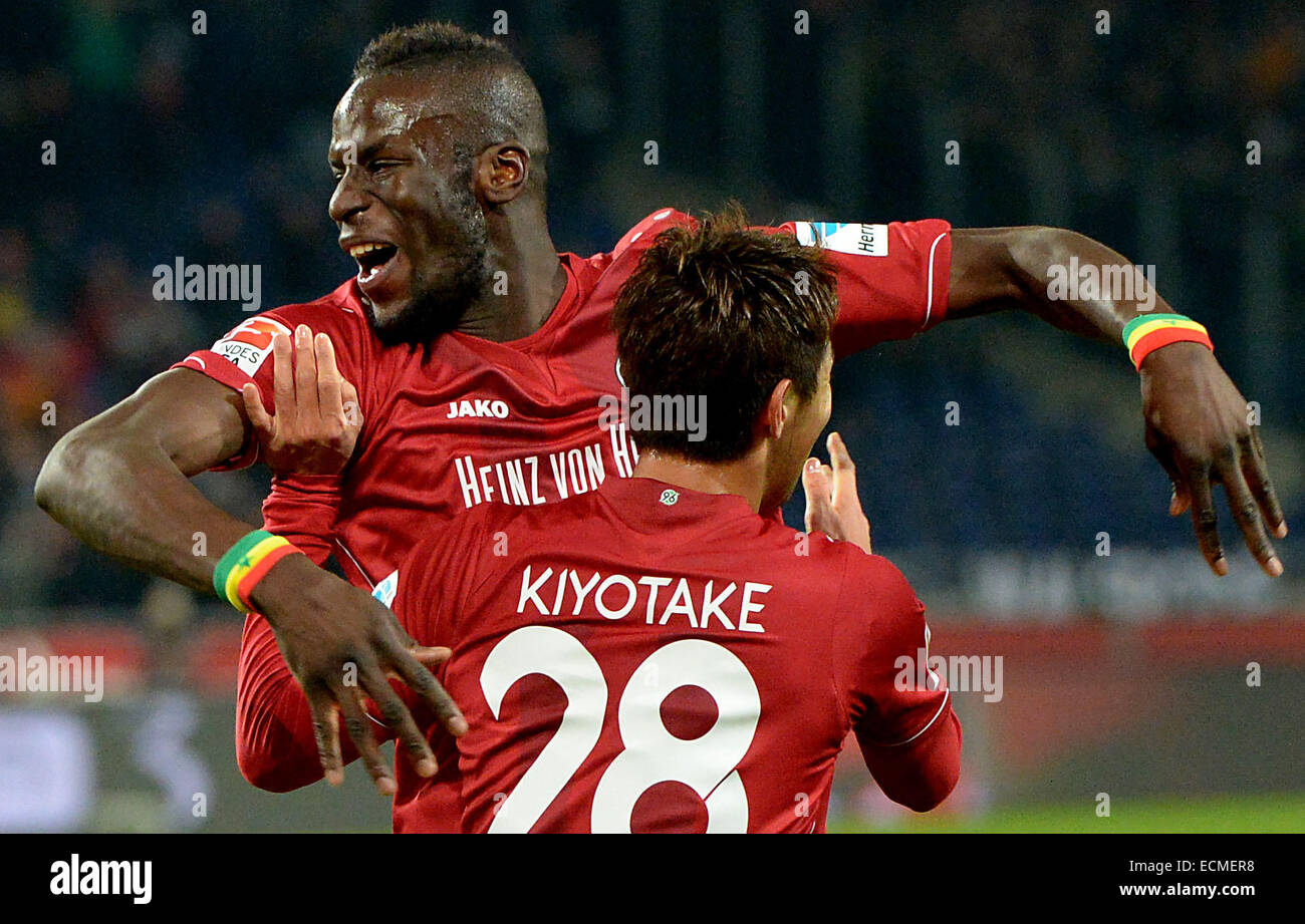Hanover, Germany. 16th Dec, 2014. Hannover's Salif Sane (L) cheers after his 1-0 goal with teammate Hiroshi Kiyotake (R) during the German Bundesliga soccer match between Hannover 96 and FC Augsburg at HDI-Arena in Hanover, Germany, 16 December 2014. Photo: Peter Steffen/dpa/Alamy Live News Stock Photo