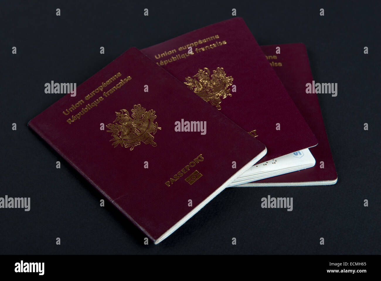 three french passports on the black table Stock Photo Alamy