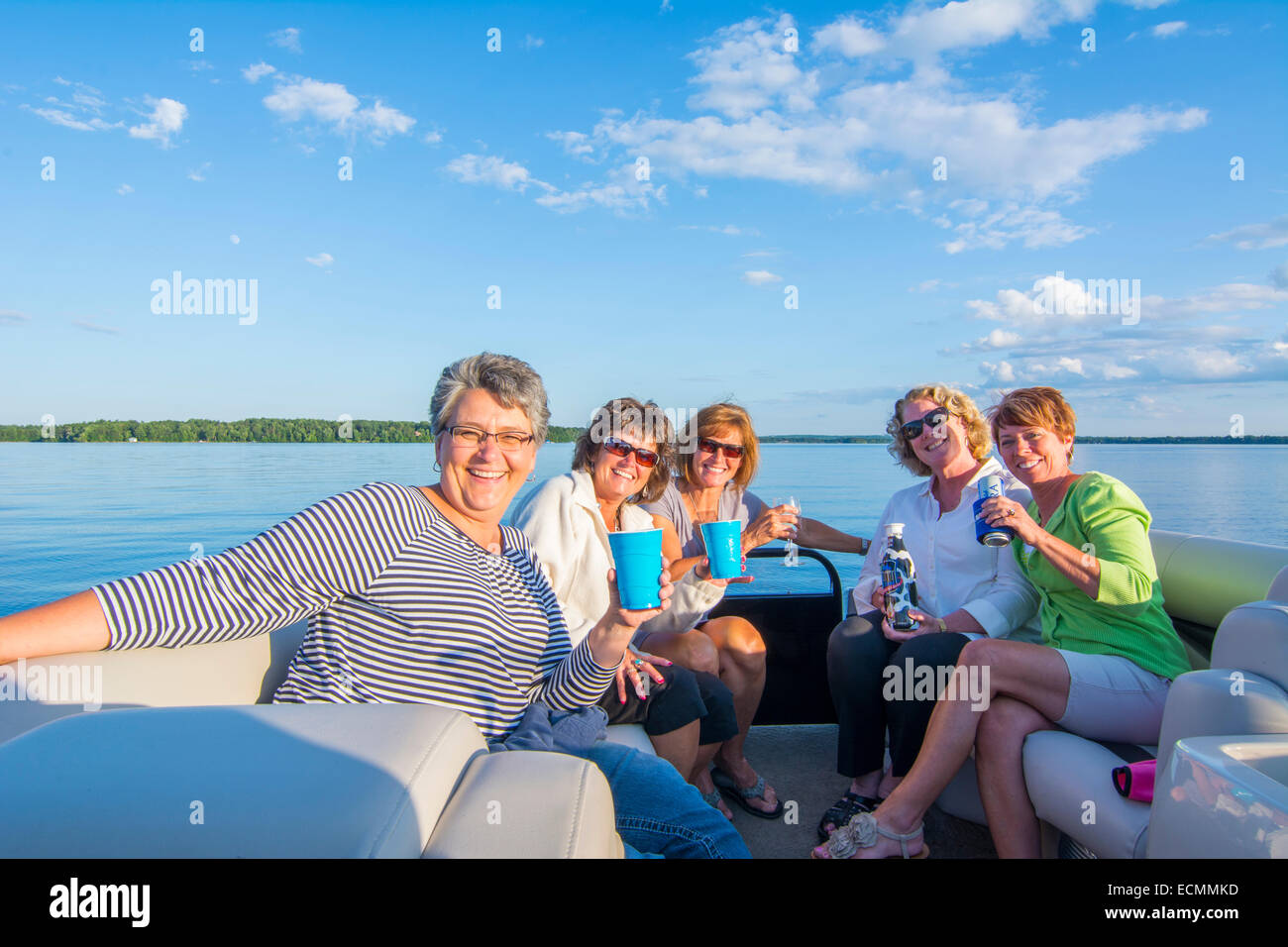 Eau Claire Wisconsin ladies relaxing on Lake Wissota on pontoon boat