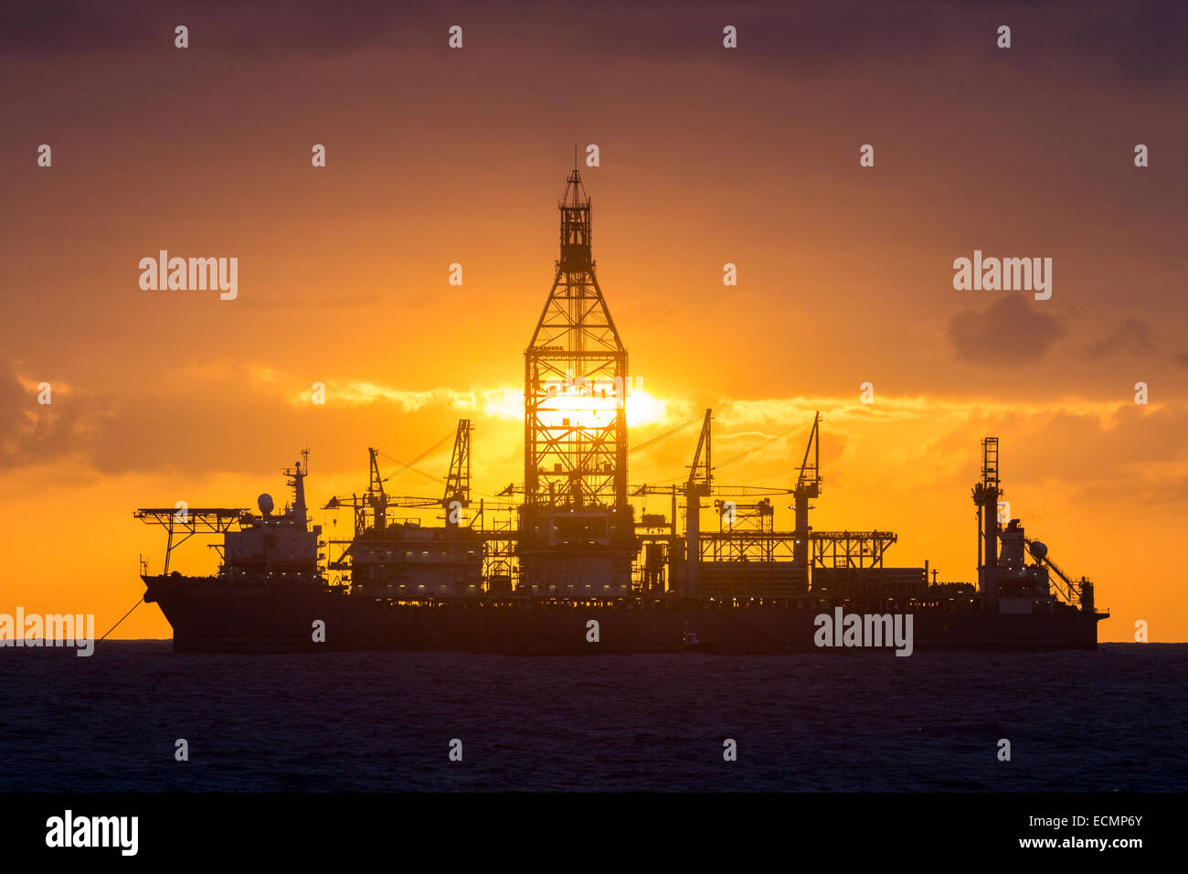 Drill ships/oil rigs at sunrise in Atlantic Ocean Stock Photo Alamy
