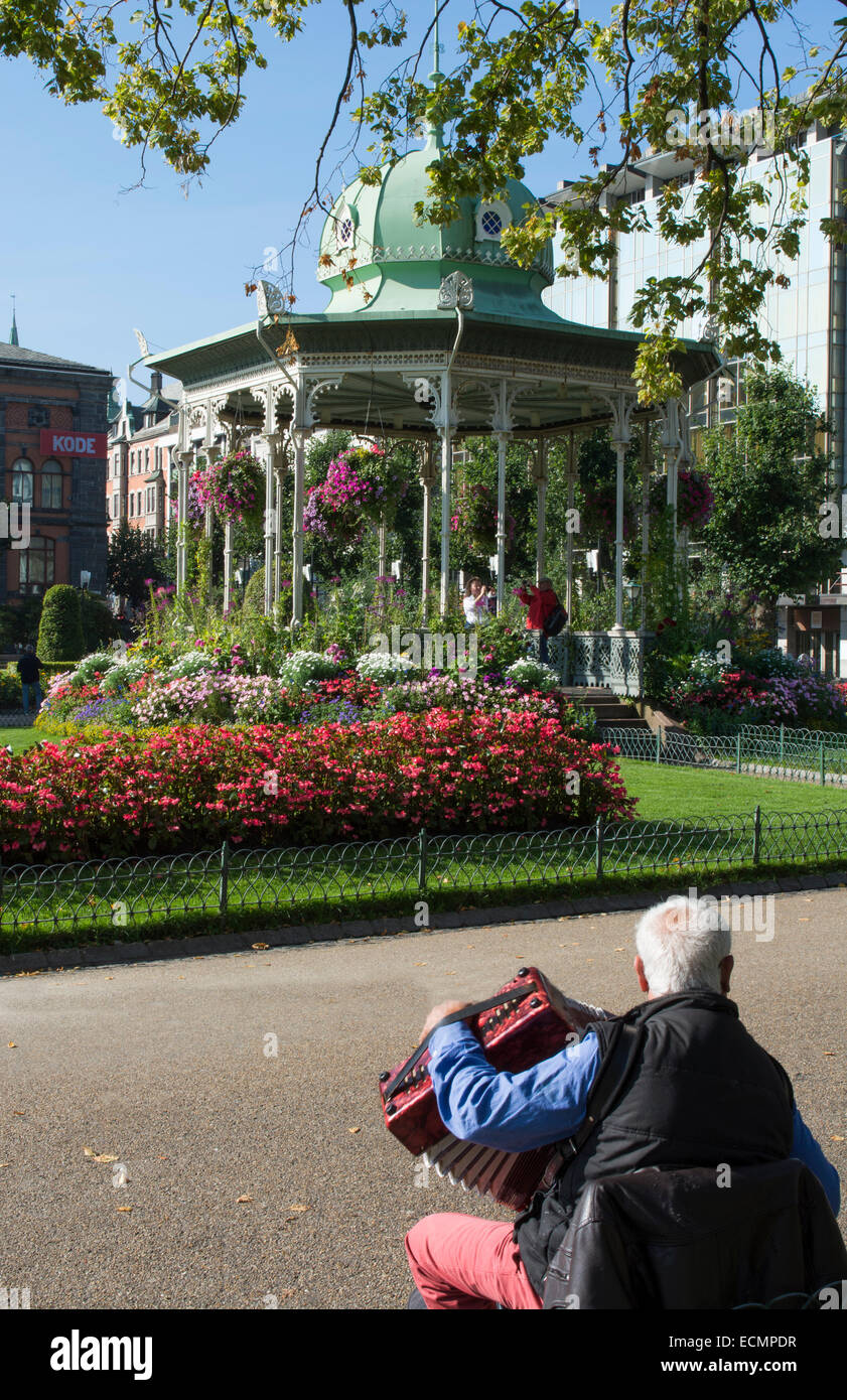 Bergen Norway music Pavillion colorful gazebo with flowers in downtown  with local man playing accordian miusic Stock Photo