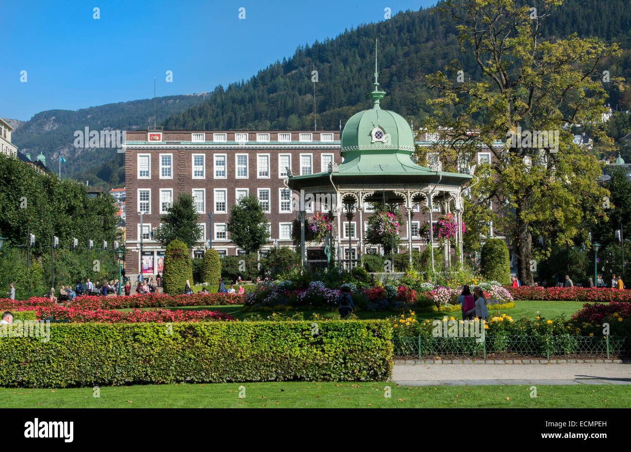 Bergen Norway music Pavillion colorful gazebo with flowers in downtown with Rikstelegraf and Rikstelefon building in background  Stock Photo