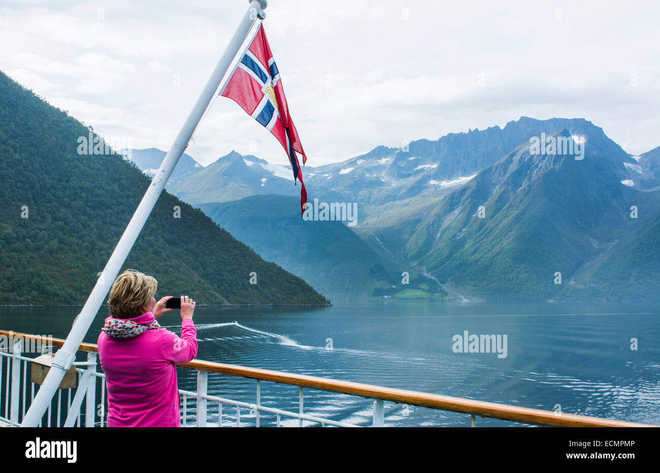 Norway cruise Hurtigruten ship fjord woman taking photo of scenic from