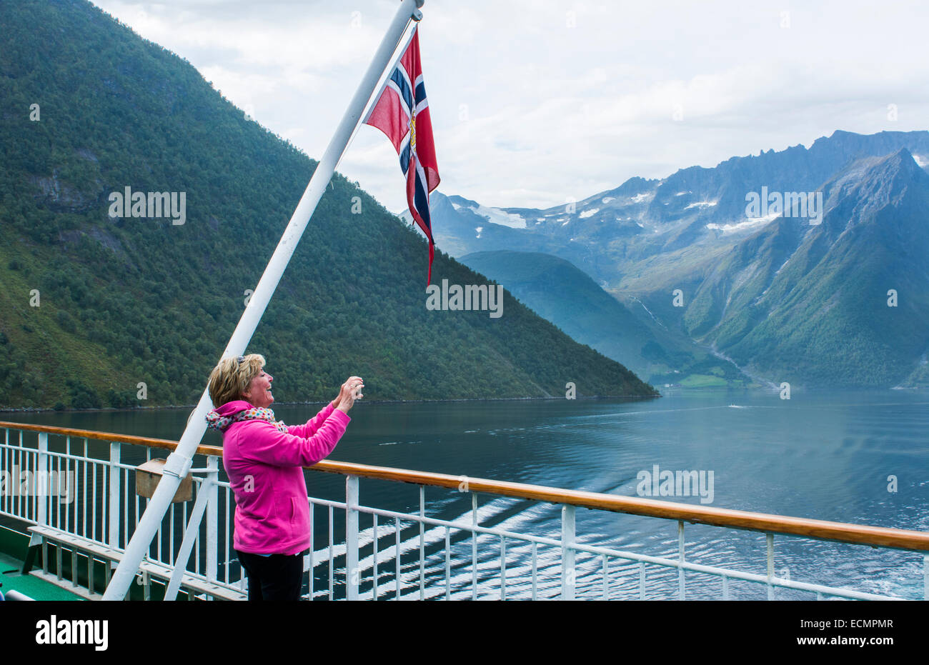 Norway cruise Hurtigruten ship fjord woman taking photo of scenic from