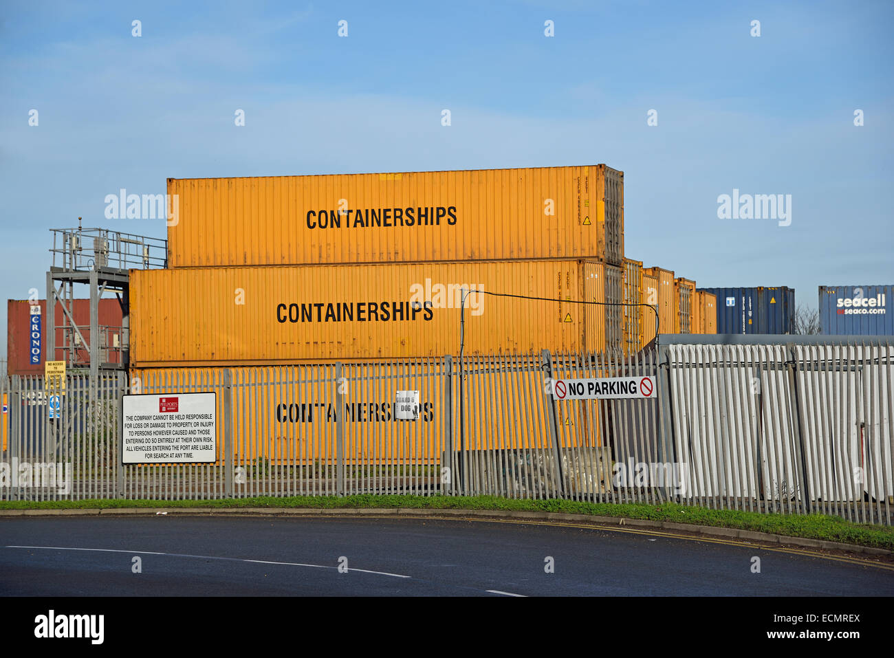 Shipping containers near the entrance of Peel Ports Medway, Sheerness Docks, Sheppey, Kent Stock Photo