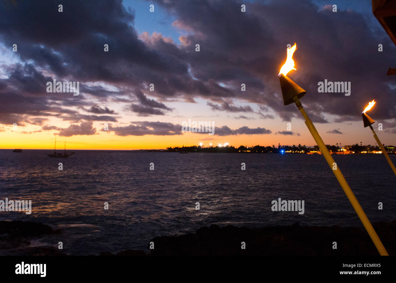 Kona Hawaii Big Island tiki fire light over Ocean at KailuaKona beach