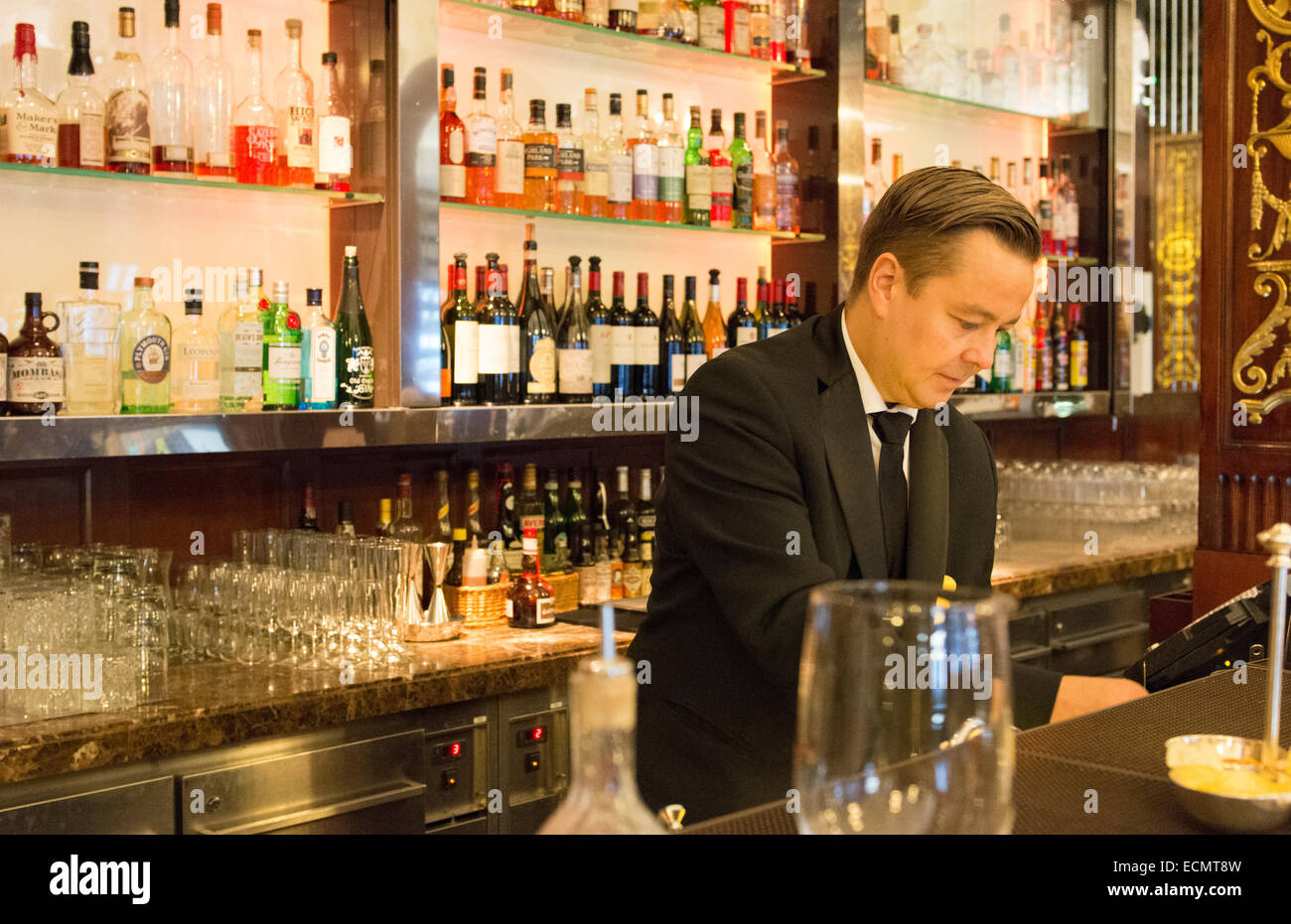Stockholm Sweden exclusive Grand Hotel bartender at bar working portrait expensive luxury hotel