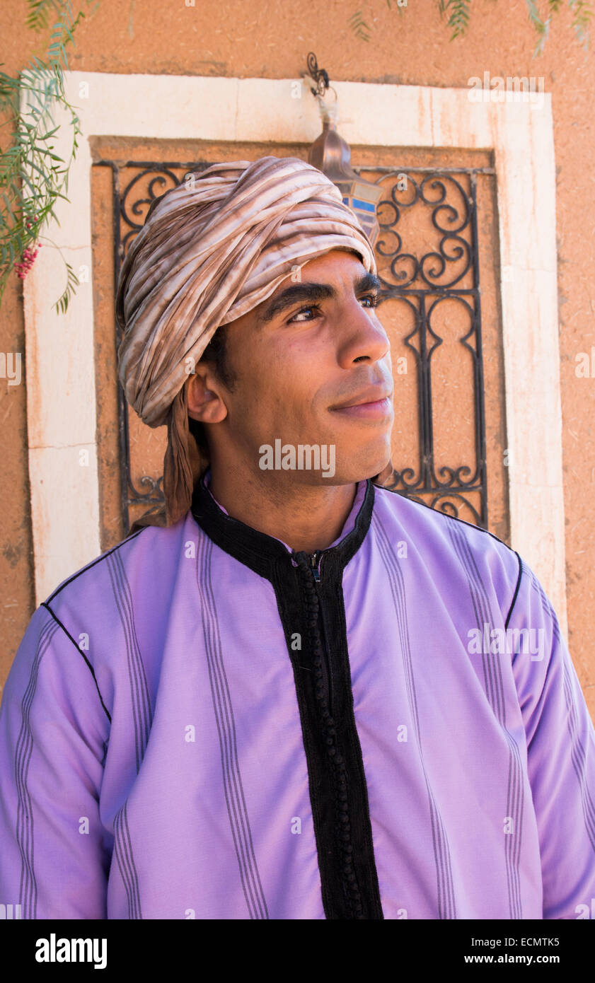 Morocco Atlas Mountains Boulmane Danes village man in purple traditional  costume with turbin portrait at doorway Stock Photo - Alamy