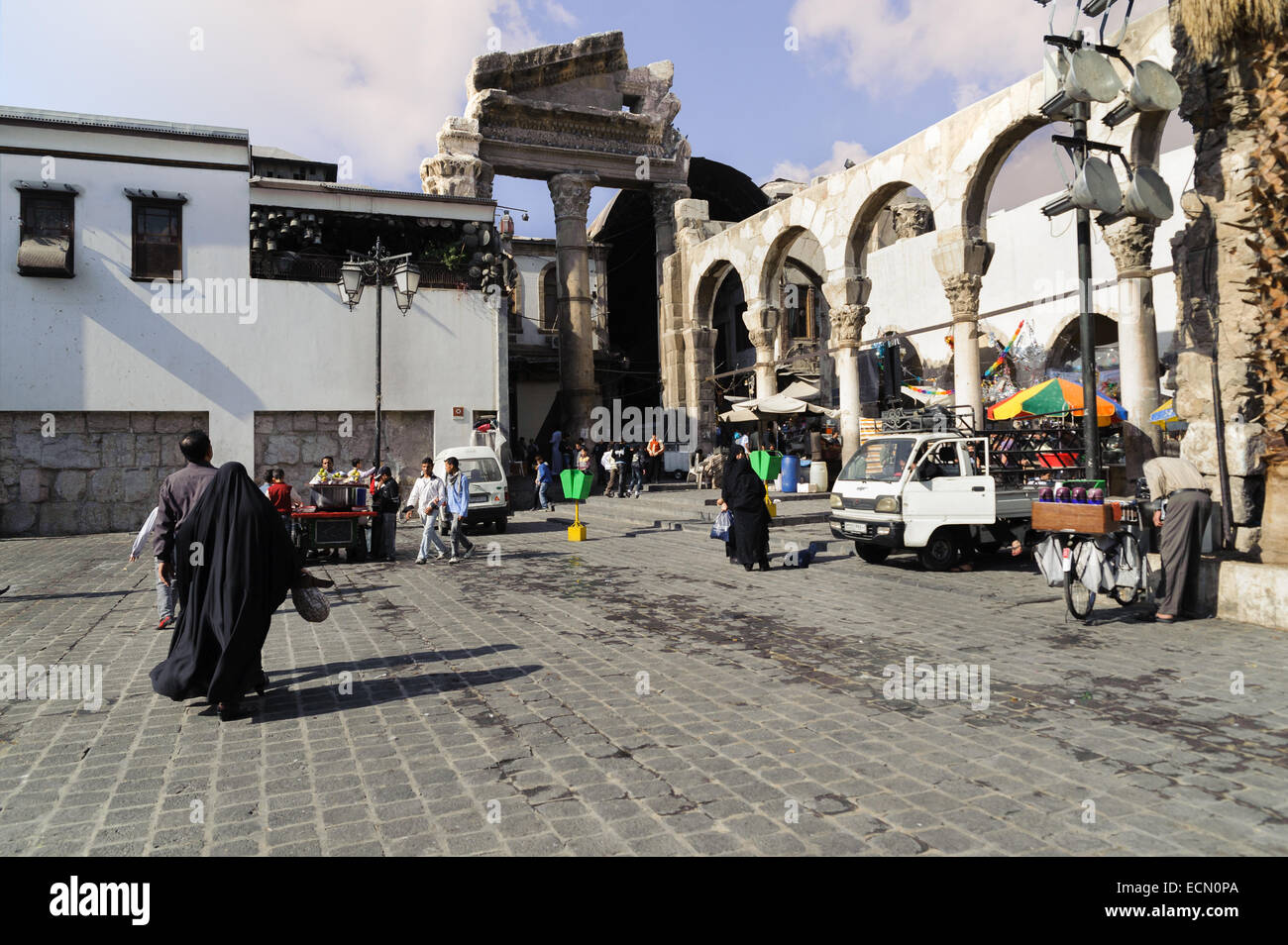 View of Al-Hamidiyah Souq entrance from back of Umayyad Mosque and Rome ruins in Damascus. Bazaar is the largest souk in Syria. Stock Photo