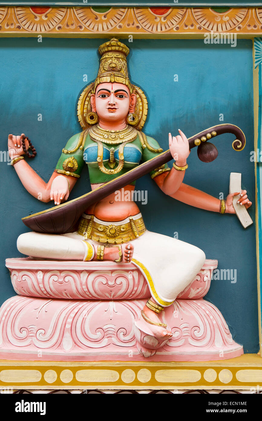Mauritius, Mahebourg, Hindu temple, colourfully painted figure of goddess Saraswati playing veena Stock Photo