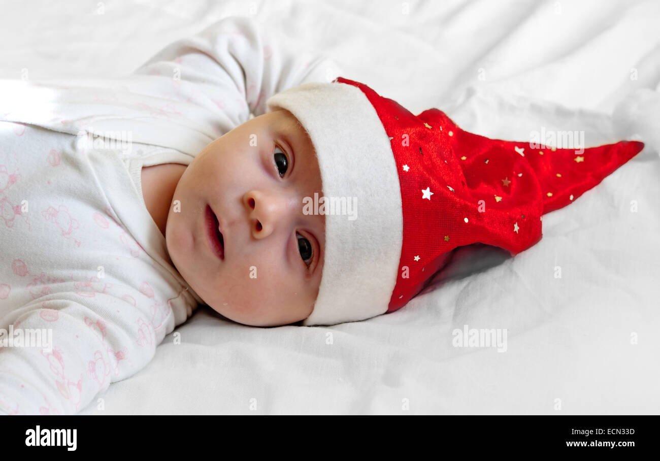 portrait of a baby boy with santa hat Stock Photo