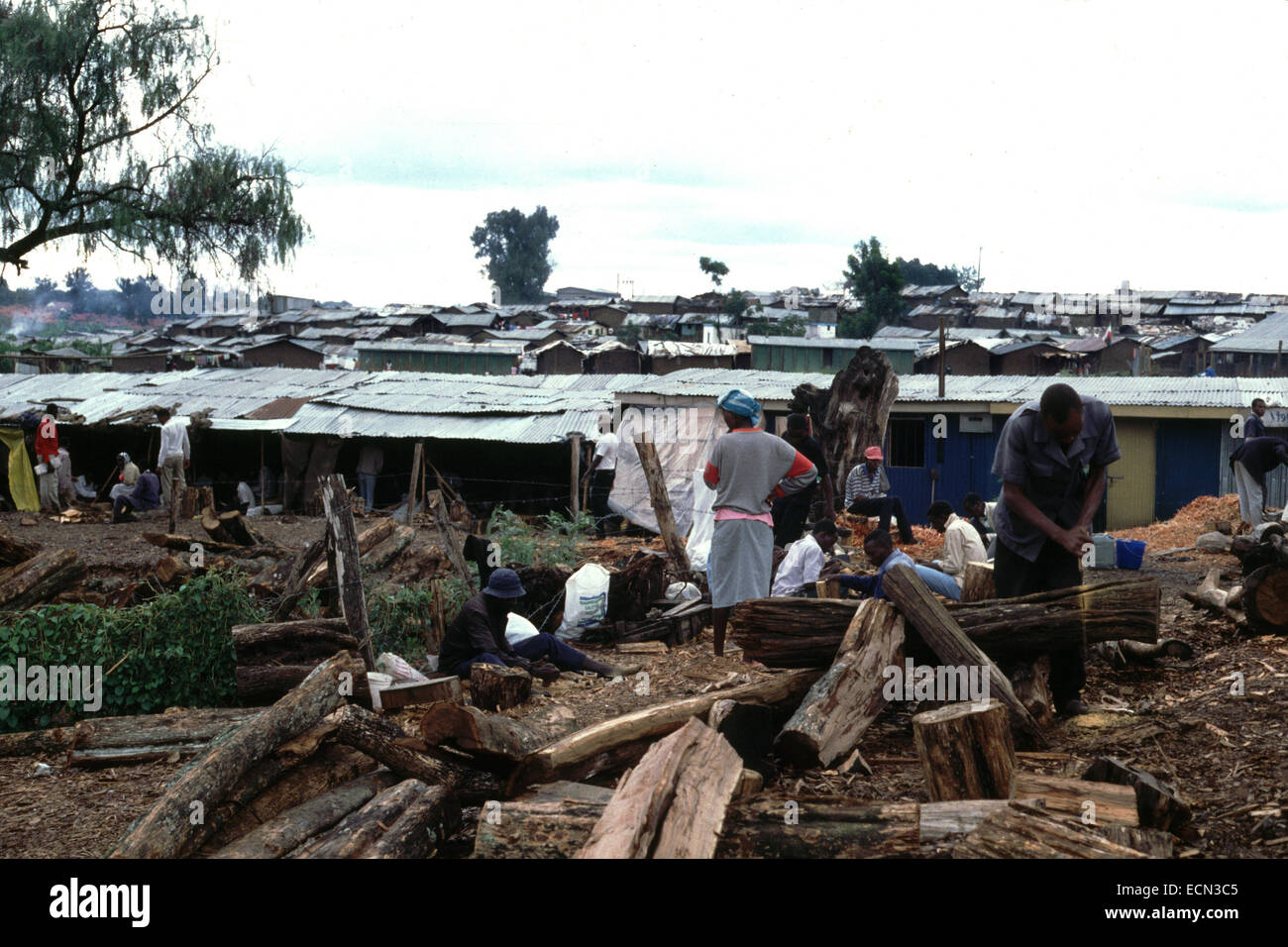 Men cutting wood in Nairobi slums Kenya circa 1994 Stock Photo Alamy