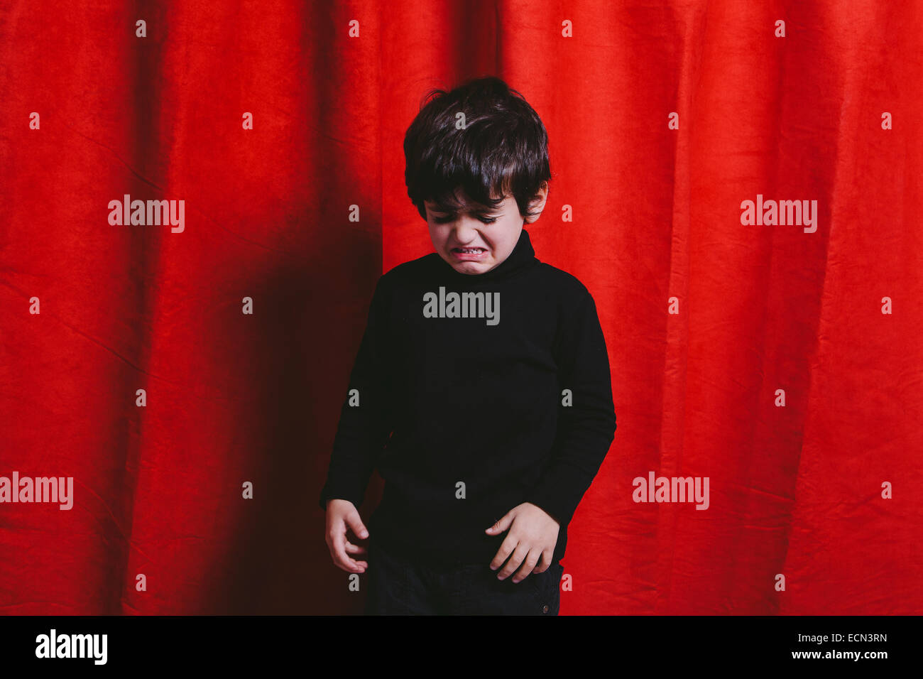 Studio portrait of a three year old boy crying Stock Photo