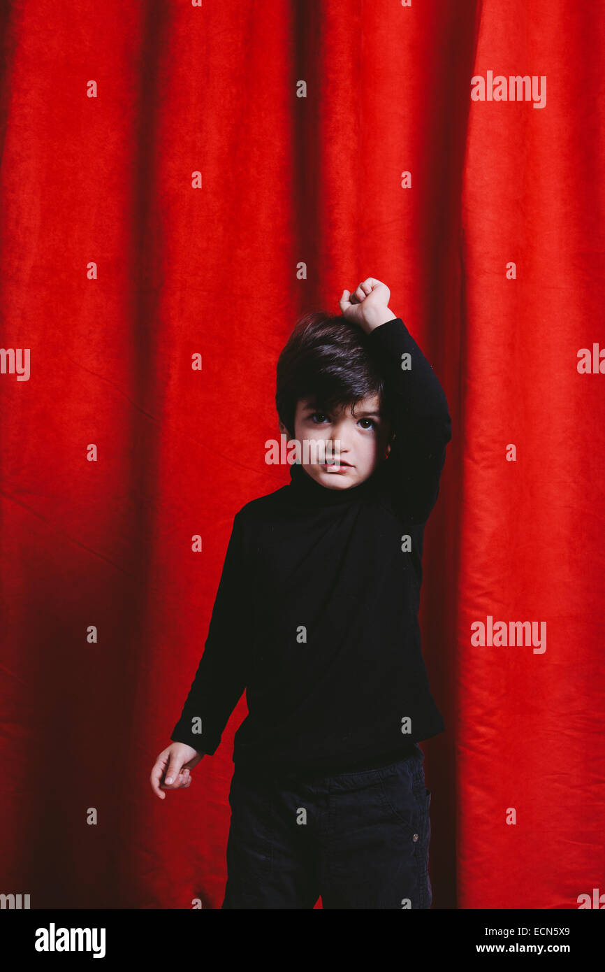 Studio portrait of a three year old boy wearing black clothes Stock Photo
