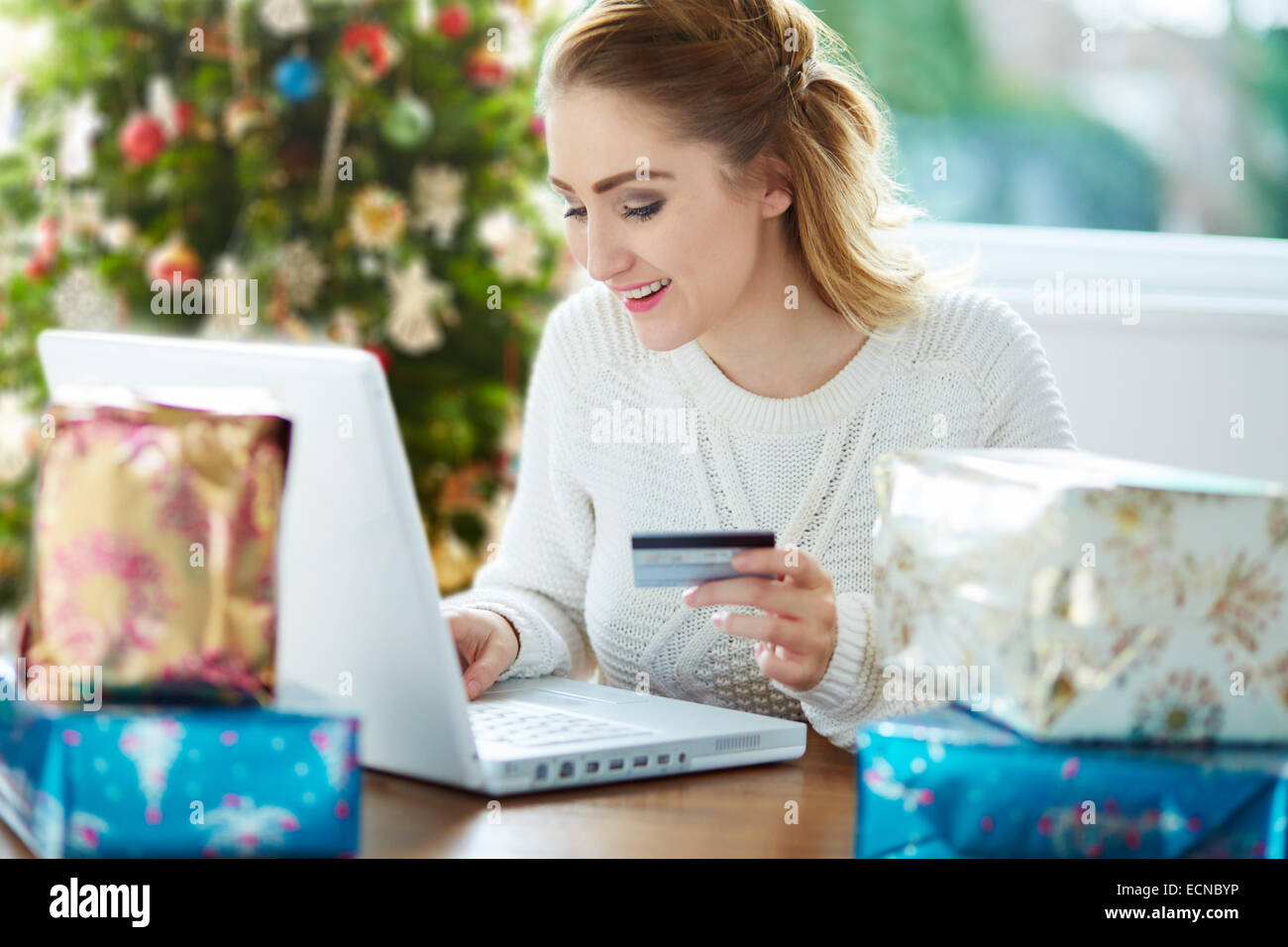 Woman shopping online at Christmas Stock Photo