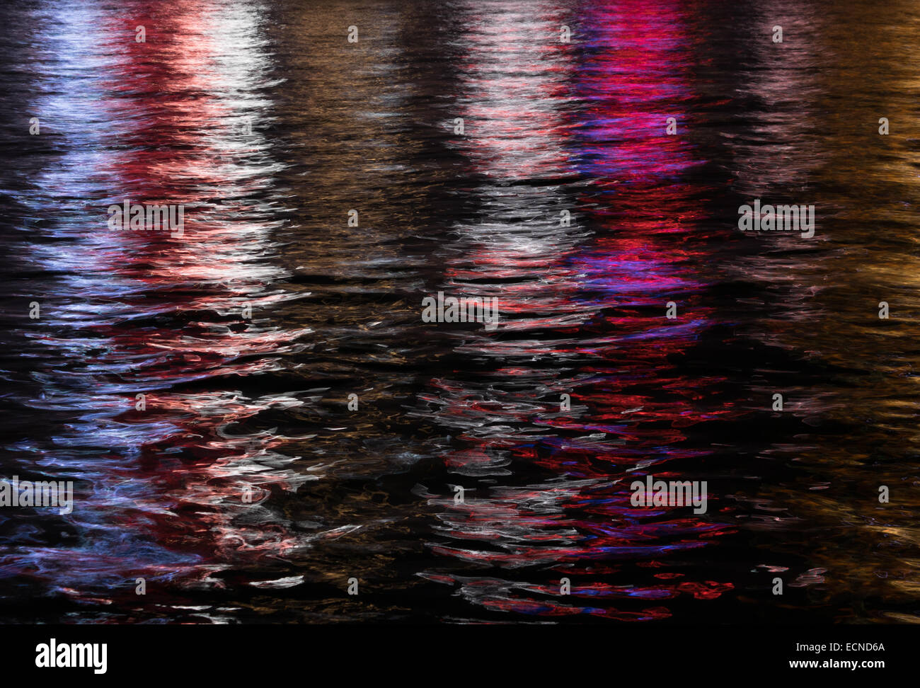 Reflection of city lights in Kowloon Bay, Hong Kong.  Shimmer and stripes produce an artistic abstract oil painting like effect. Stock Photo