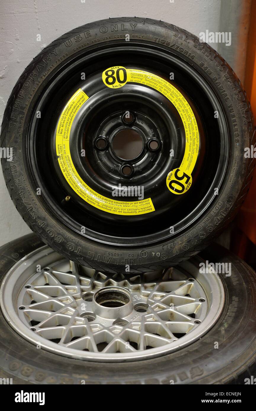 Compact spare tire in a garage, Germany, city of Osterode, 11. December 2014.  Photo: Frank May Stock Photo - Alamy