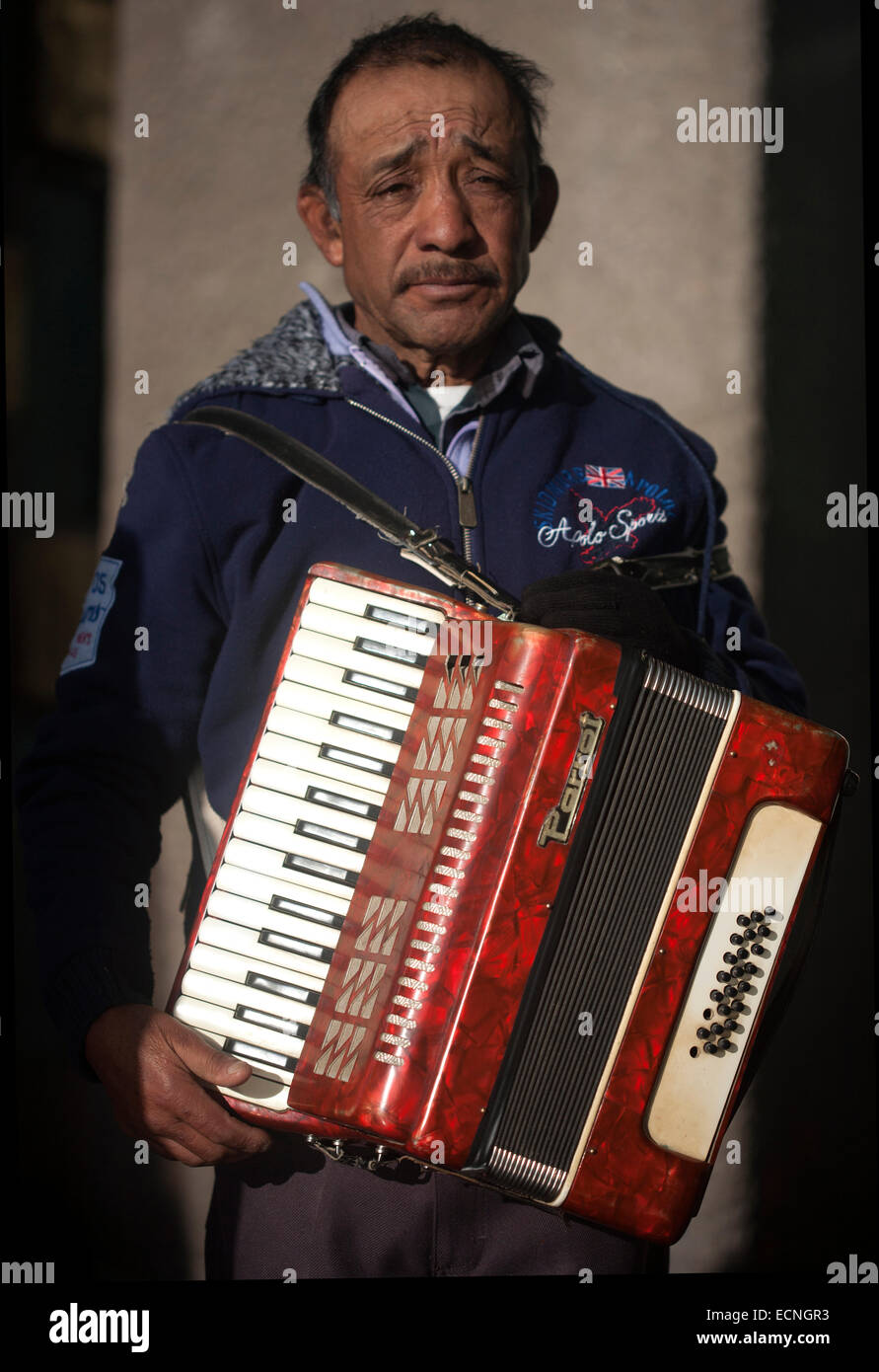 An accordionist poses during the annual pilgrimage to the Basilica of Our Lady of Guadalupe, Tepeyac Hill, Mexico City, Mexico. Stock Photo