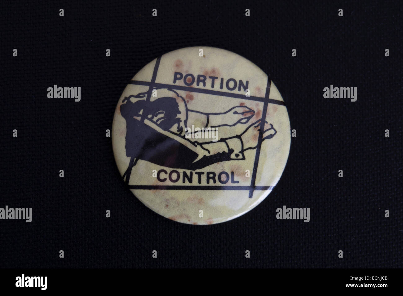 lapel badge of the 1980s promoting british electronic industrial band, portion  control Stock Photo - Alamy