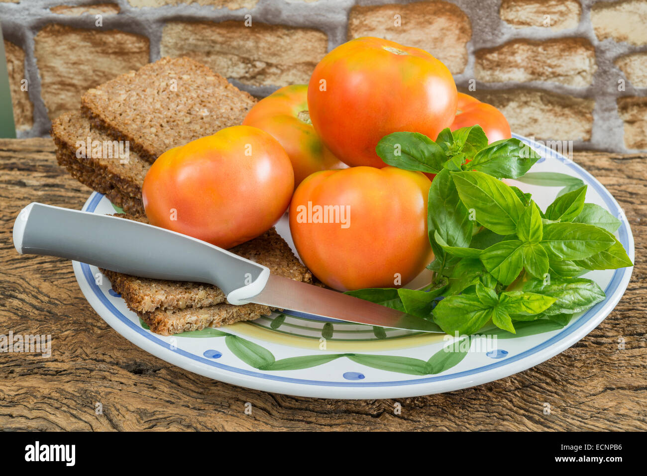 freshness basil and red tomato on wooden table Stock Photo