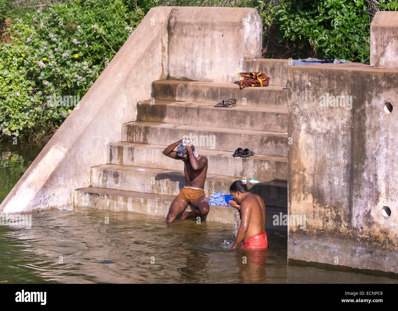 Men taking morning bath in river Stock Photo Alamy
