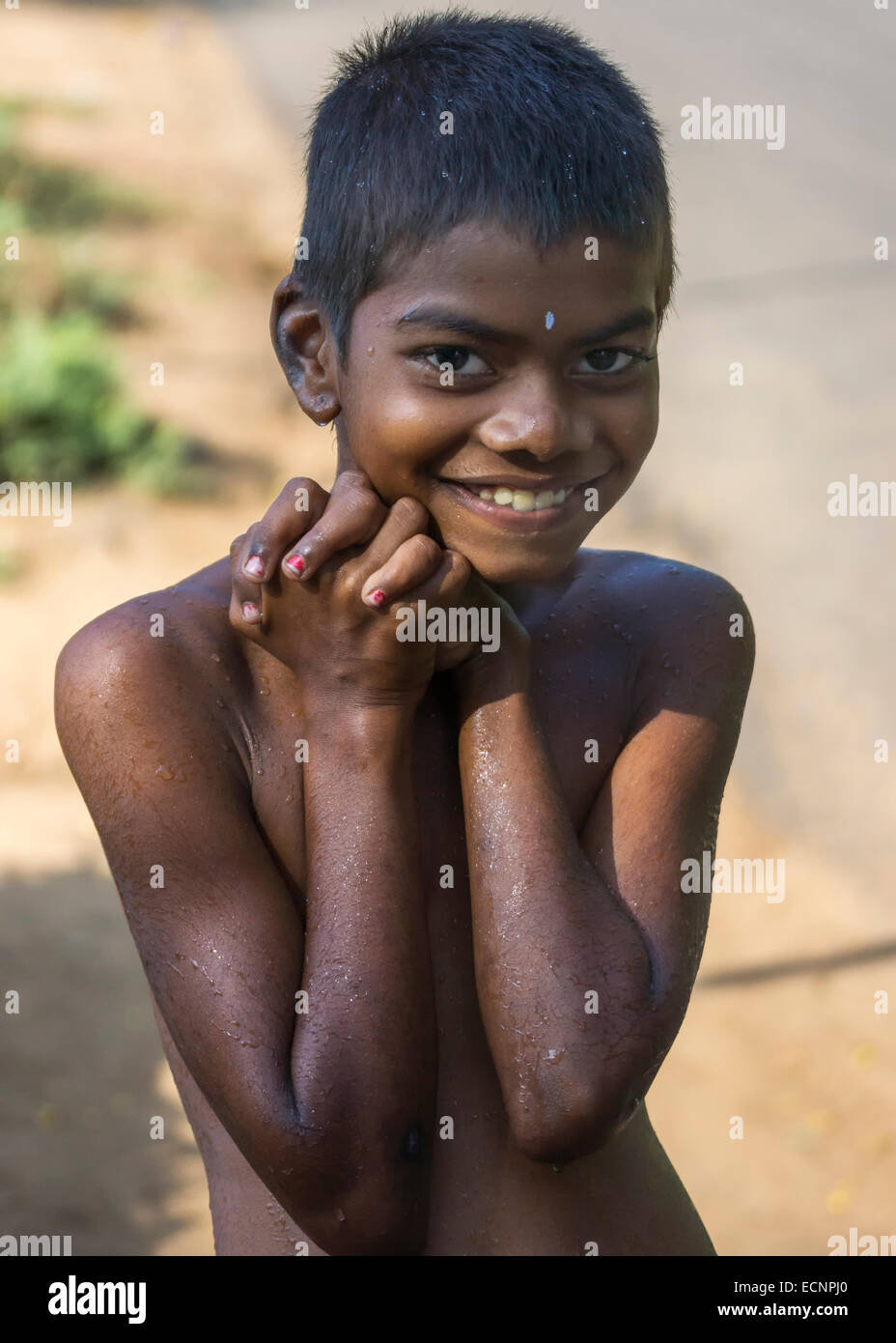 Young smiling boy with red nails. Stock Photo