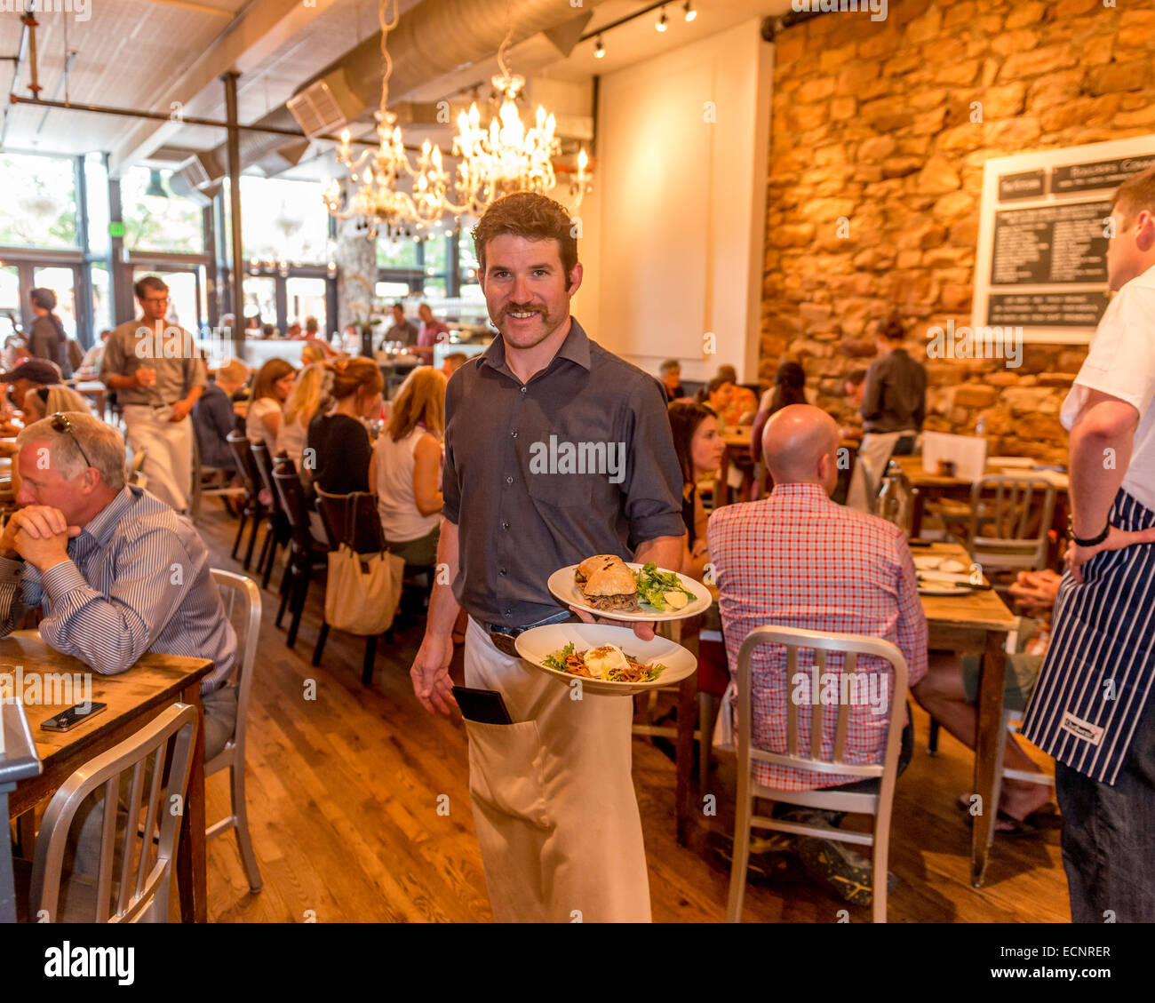 Waiter Carrying Food Plates At The Kitchen Restaurant Boulder Stock Photo Alamy