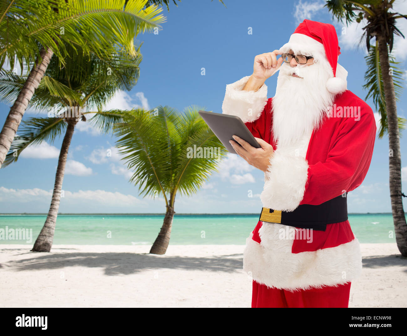 man in costume of santa claus with tablet pc Stock Photo - Alamy