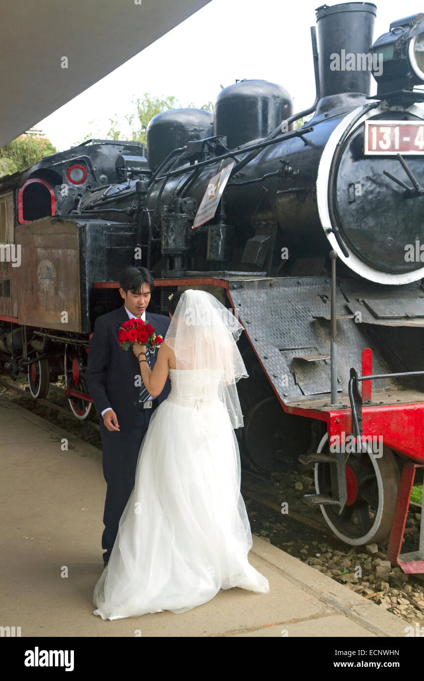 Wedding couple at the Da Lat Railway Station, Vietnam. Stock Photo