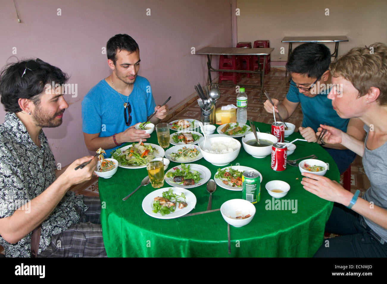 Tourists eating vietnamese lunch near Da Lat, Vietnam. Stock Photo