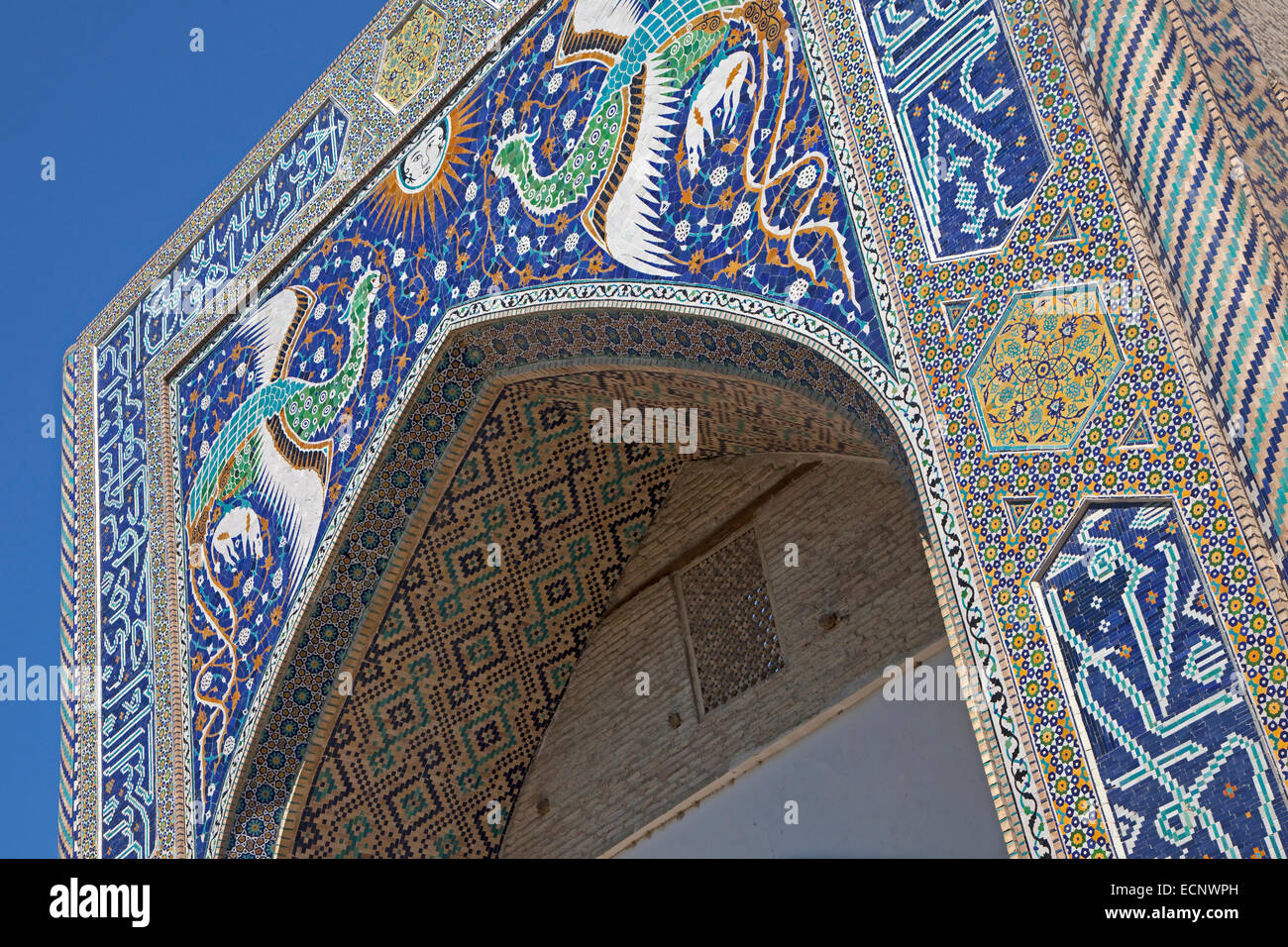 Phoenixes on portal of Nadir Divan-Beghi madrasah, part of Lyab-i Hauz complex, Bukhara / Buxoro on old Silk Road, Uzbekistan Stock Photo