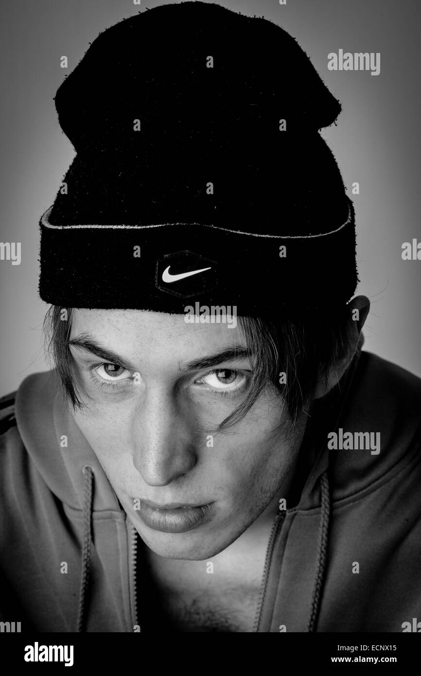 Young white male headshot with urban street look in black and white. Stock Photo