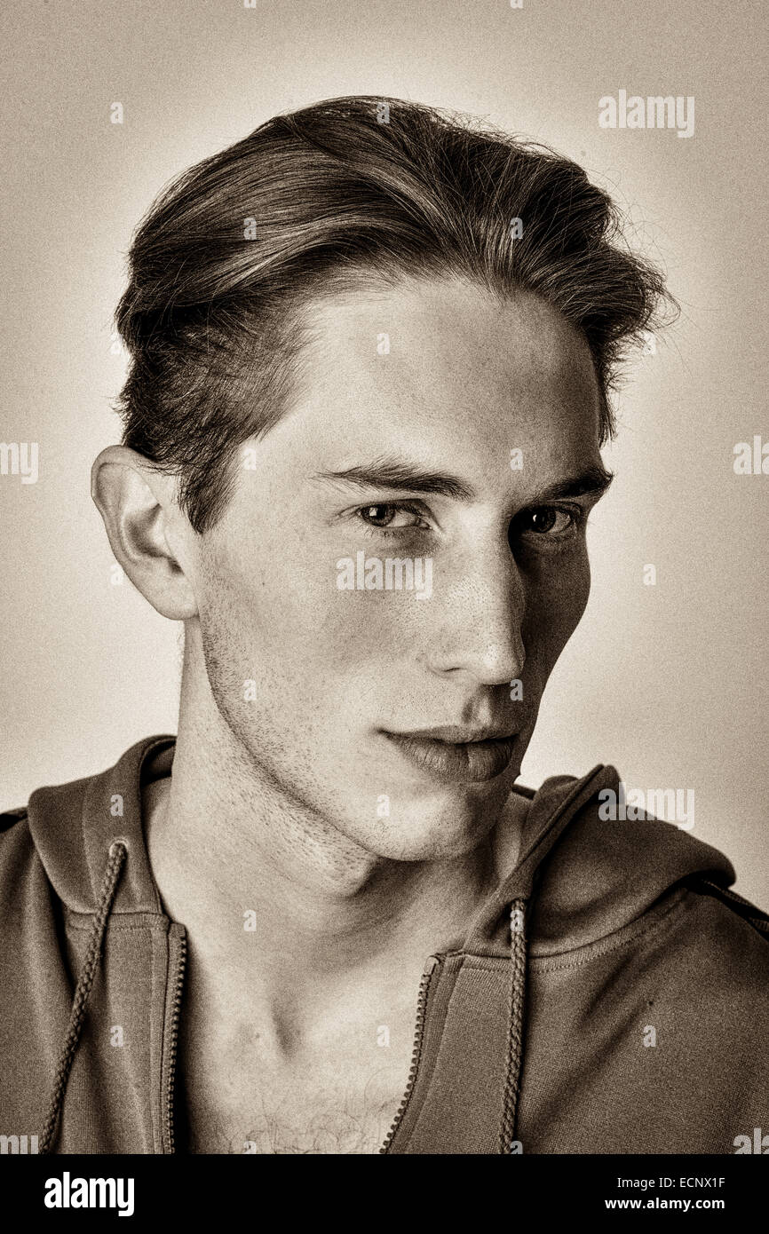 Young white male headshot with urban street look in black and white. Stock Photo