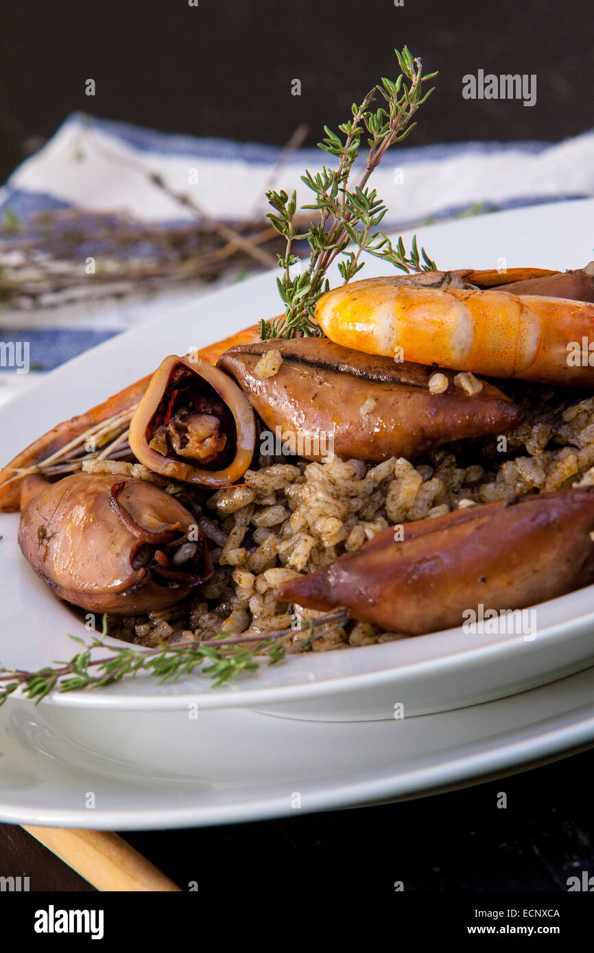 italian risotto with squid and prawn on black ink Stock Photo