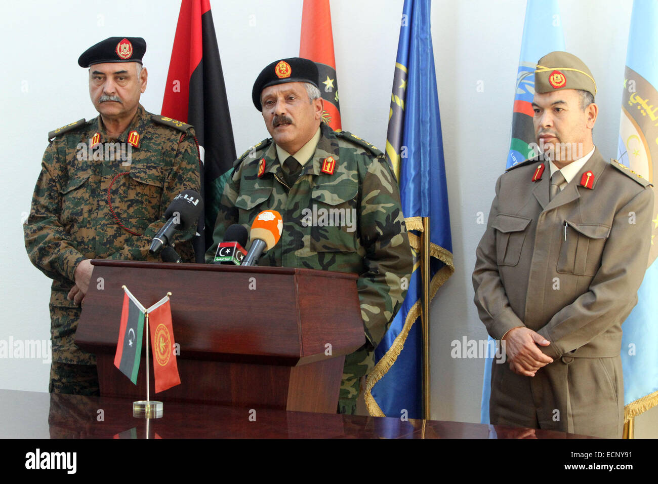 Tripoli, Libya. 17th Dec, 2014. Major-General Abdessalem Jadallah al-Obeidi (C), chief of the expired General National Congress's army attends a news conference in Tripoli, Libya, Dec. 17, 2014. During the news conference, Obeidi announced that a joint military operation chamber was formed to control military operations in Libya. Obeidi was sacked by the Libyan new parliament House of Representatives as the chief of staff but still recognized by the expired General National Congress. Credit:  Hamza Turkia/Xinhua/Alamy Live News Stock Photo