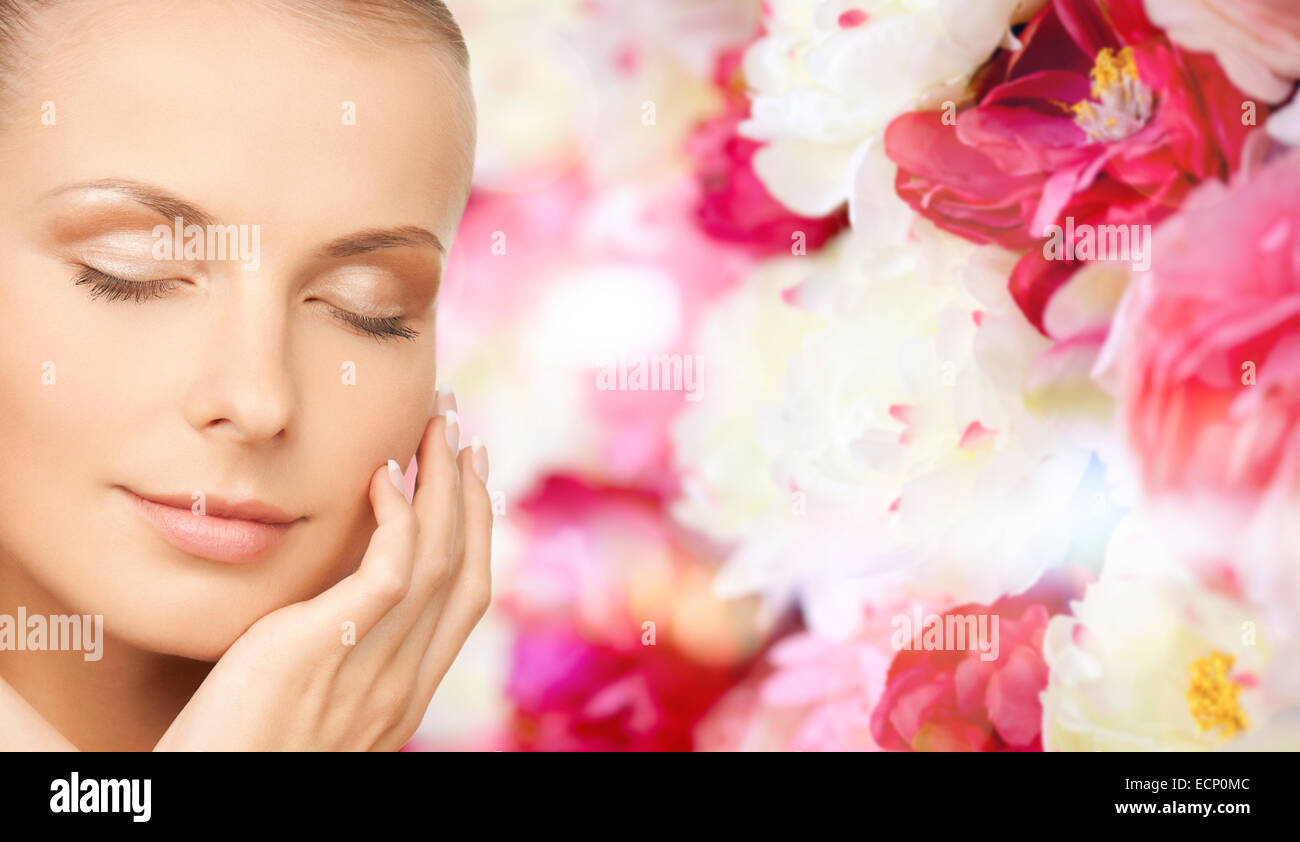 beautiful young woman touching her face Stock Photo - Alamy