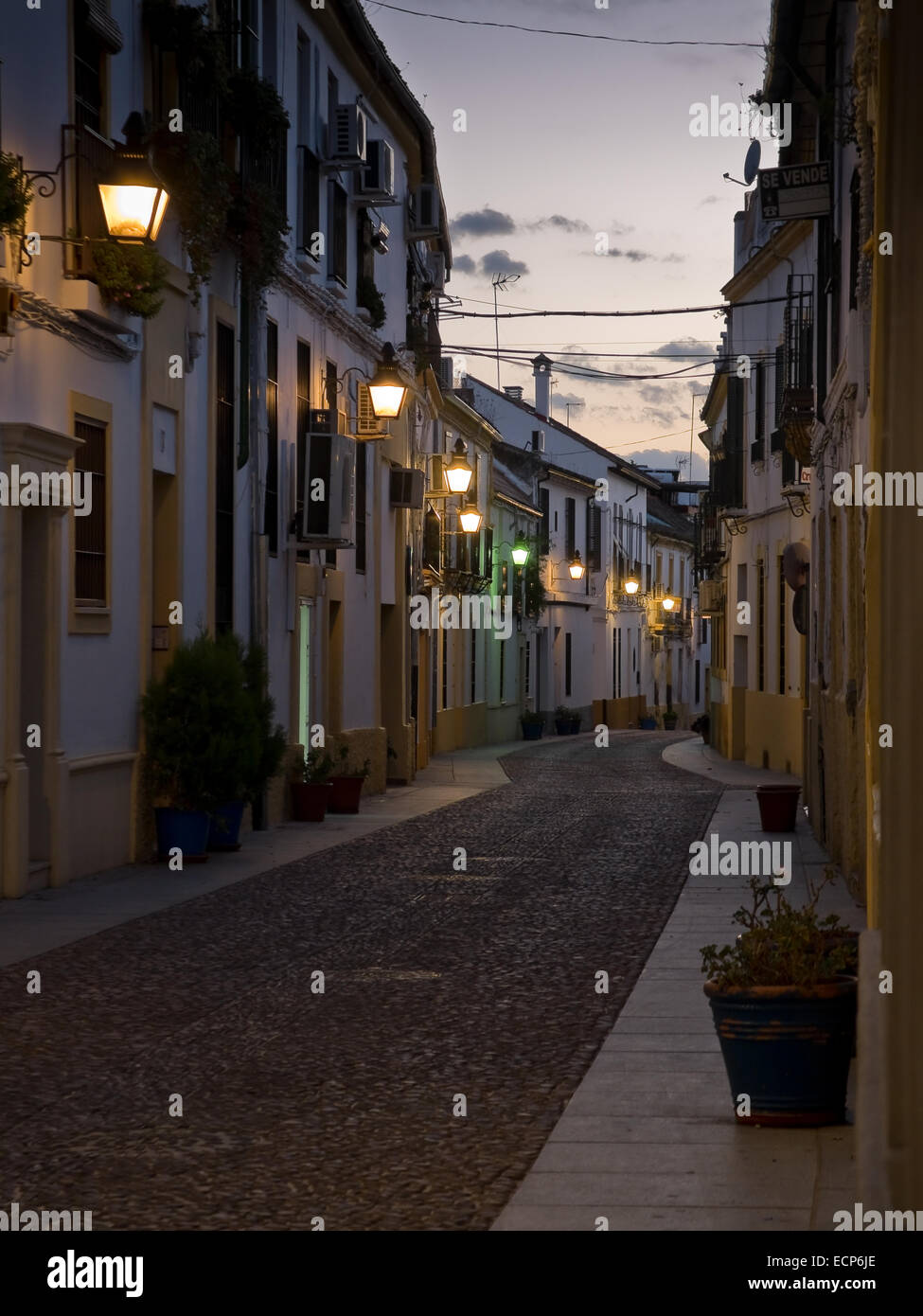 Typical street of Cordoba old town at sunset. Andalusia, Spain. Stock Photo