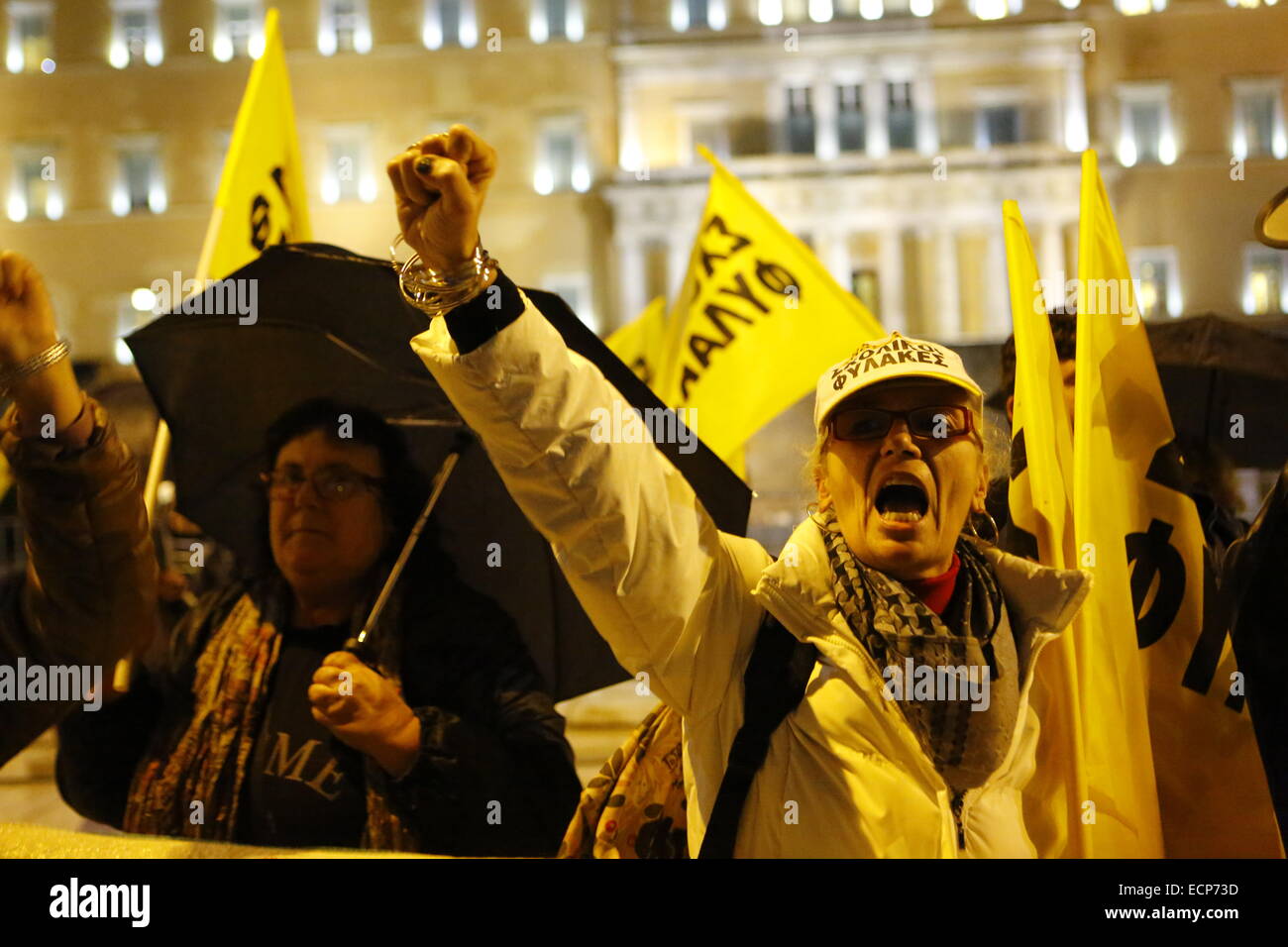 Athens, Greece. 17th December 2014. Protesters shout slogans against the Greek Government outside the Greek Parliament. Greeks opposed to the current government protested outside the Parliament while the parliamentarians inside went to the ballot box for the first ballot of the Greek Presidential election. The governmental candidate got only 160 of the required 200 votes. Credit:  Michael Debets/Alamy Live News Stock Photo