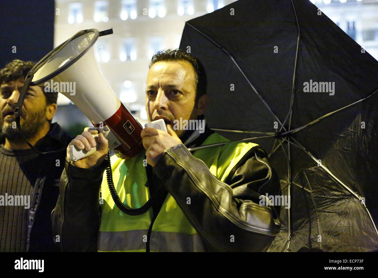 Athens, Greece. 17th December 2014. Protesters shout slogans against the Greek Government outside the Greek Parliament. Greeks opposed to the current government protested outside the Parliament while the parliamentarians inside went to the ballot box for the first ballot of the Greek Presidential election. The governmental candidate got only 160 of the required 200 votes. Credit:  Michael Debets/Alamy Live News Stock Photo