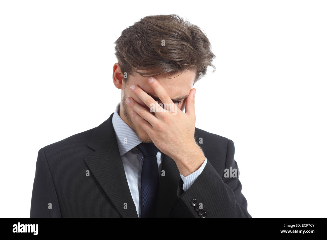 Worried or ashamed man covering his face with hand isolated on a white background Stock Photo