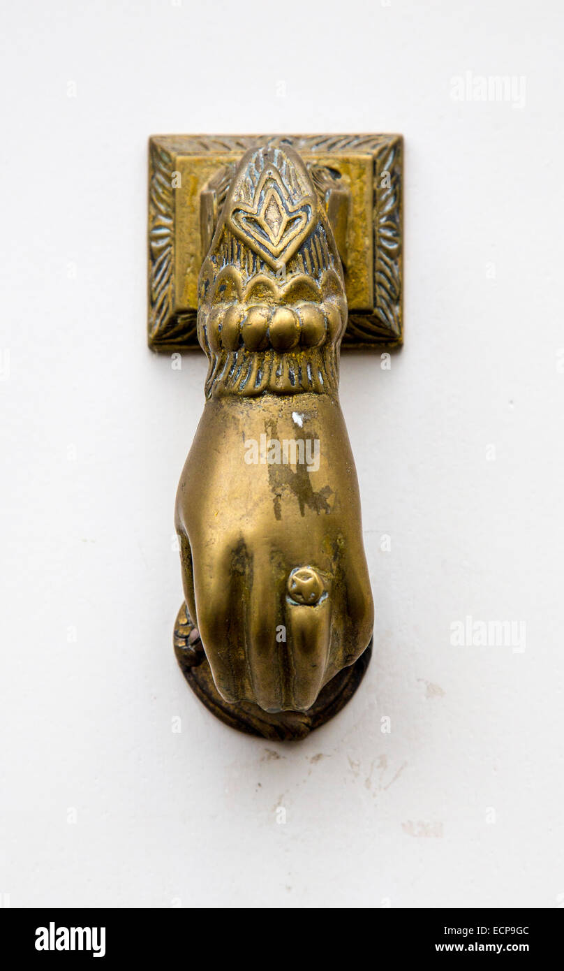 Metal doorknob in the shape of a hand Stock Photo