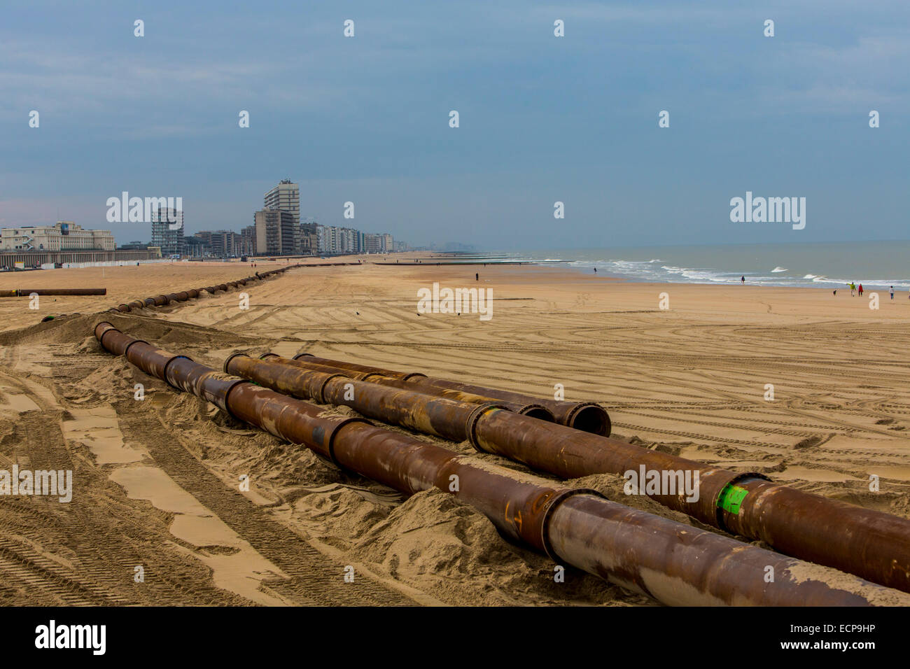 Beach nourishment, work on the sandy beach in Oostende, sand is extracted from the sea off the coast and rinsed again on the bea Stock Photo