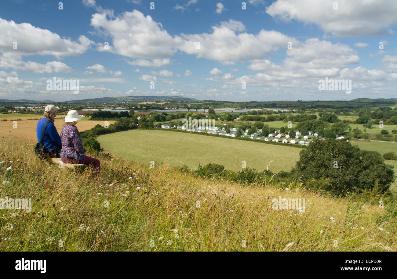 Couple sitting together on hill hi-res stock photography and images - Alamy