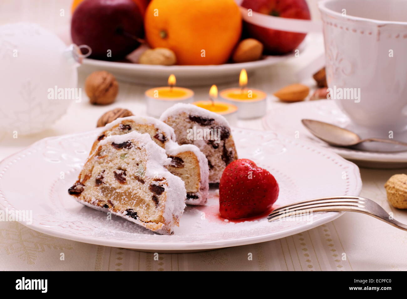 Christmas stollen cake with winter fruit, close up Stock Photo