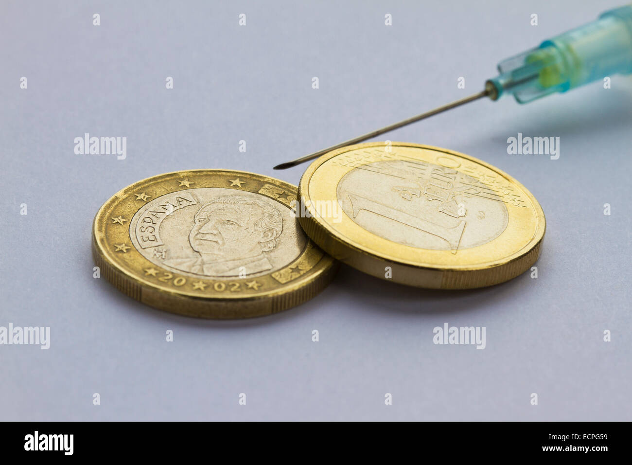 Syringe symbol of EU financial support of Spanish economy Stock Photo