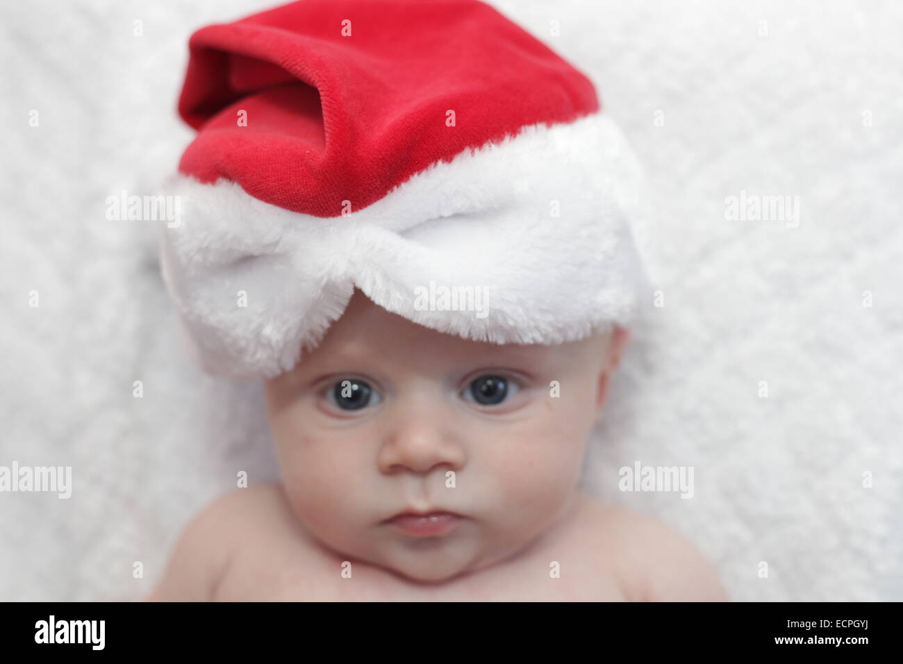 Baby boy in a Santa hat Stock Photo Alamy