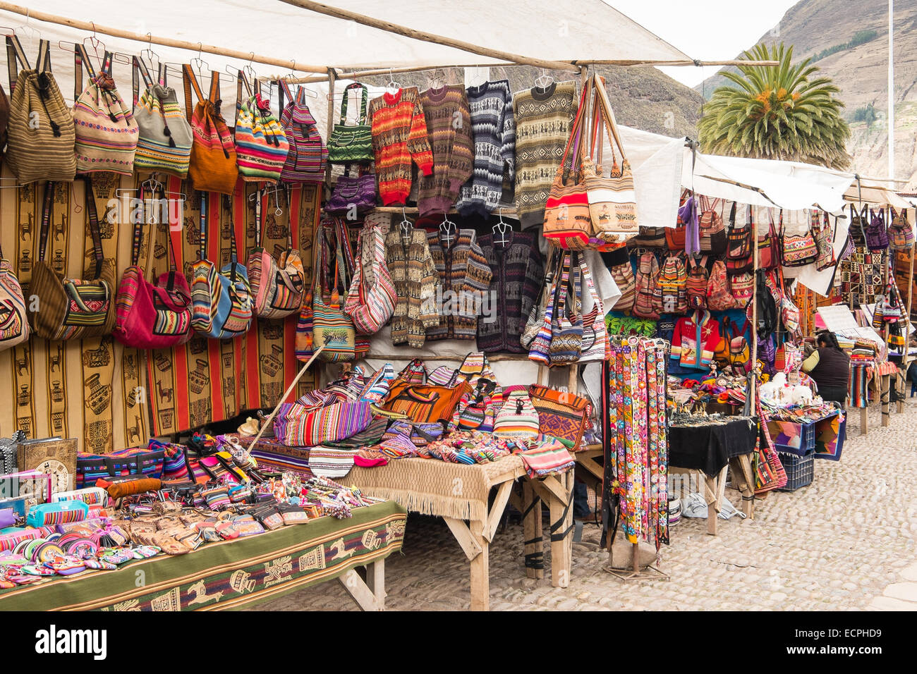 Brightly coloured bags and jumpers on sale in Pisac Market, Peru Stock Photo
